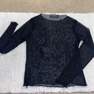 Translucent glittery black top